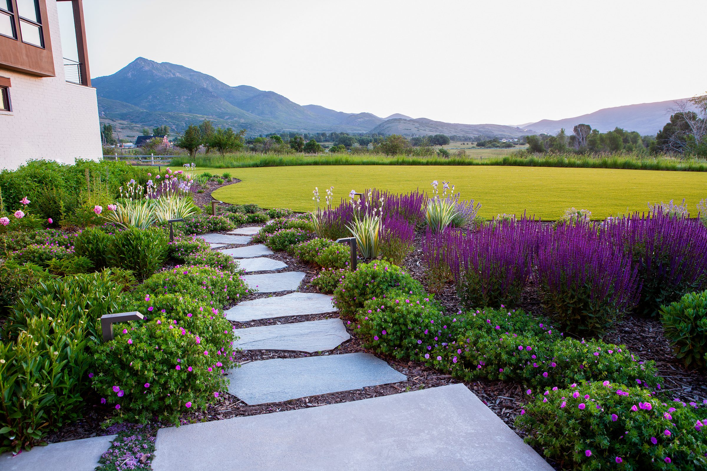 Scenic garden pathway with mountain view