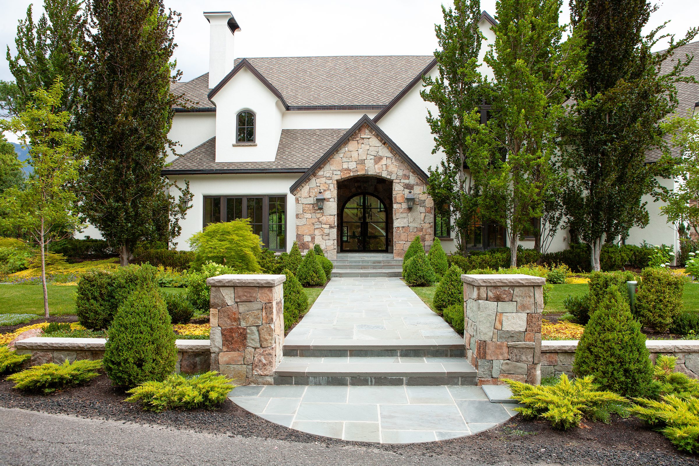 Beautiful stone house with landscaped front yard