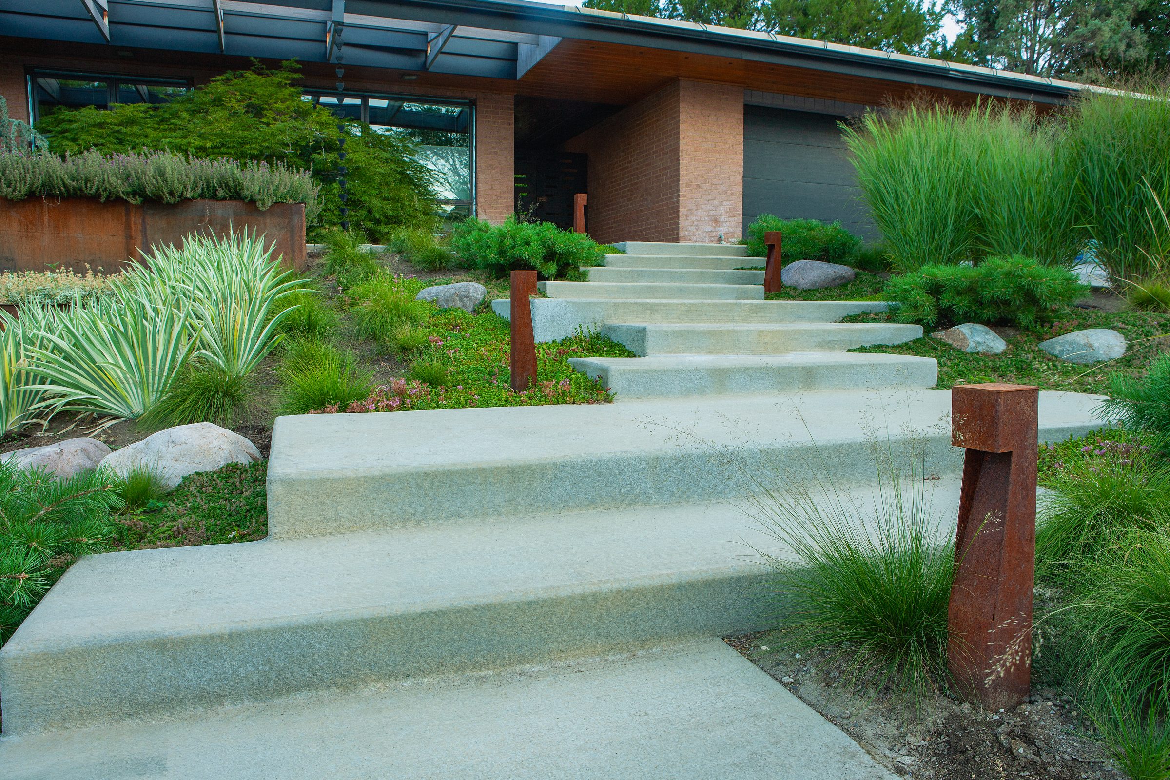 Modern house with landscaped front yard and steps
