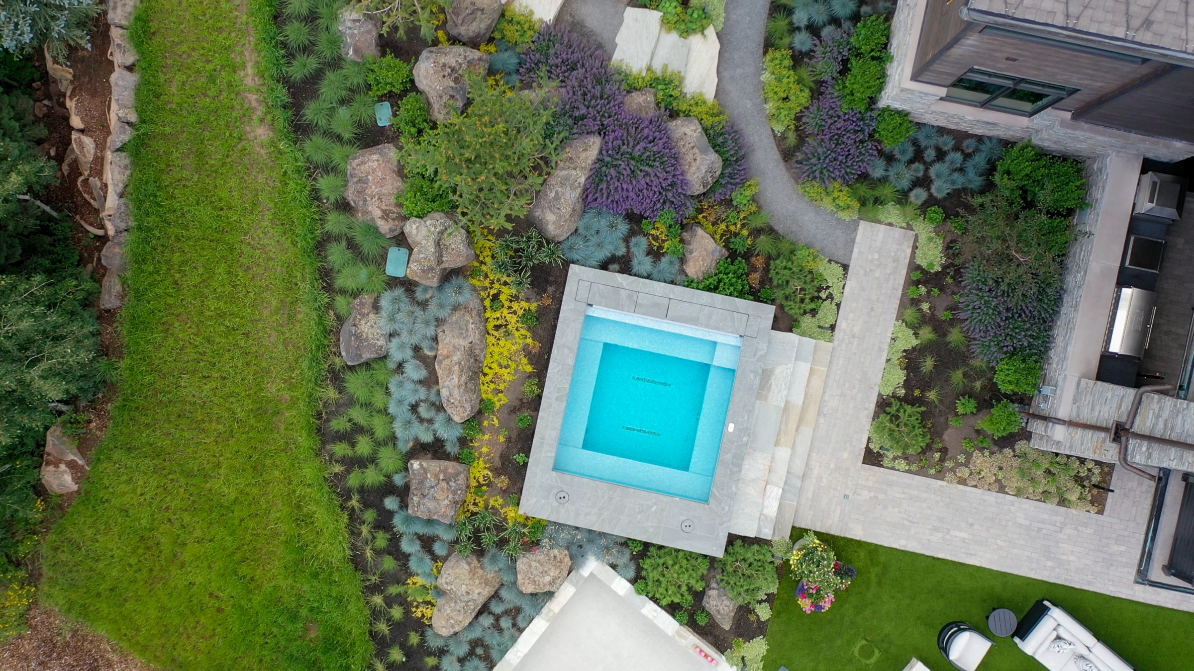 Aerial view of landscaped garden with pool.